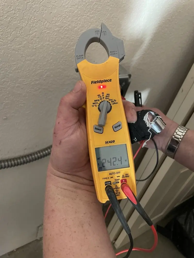 Voltage testing with clamp meter during Outlet Installation in Sage
